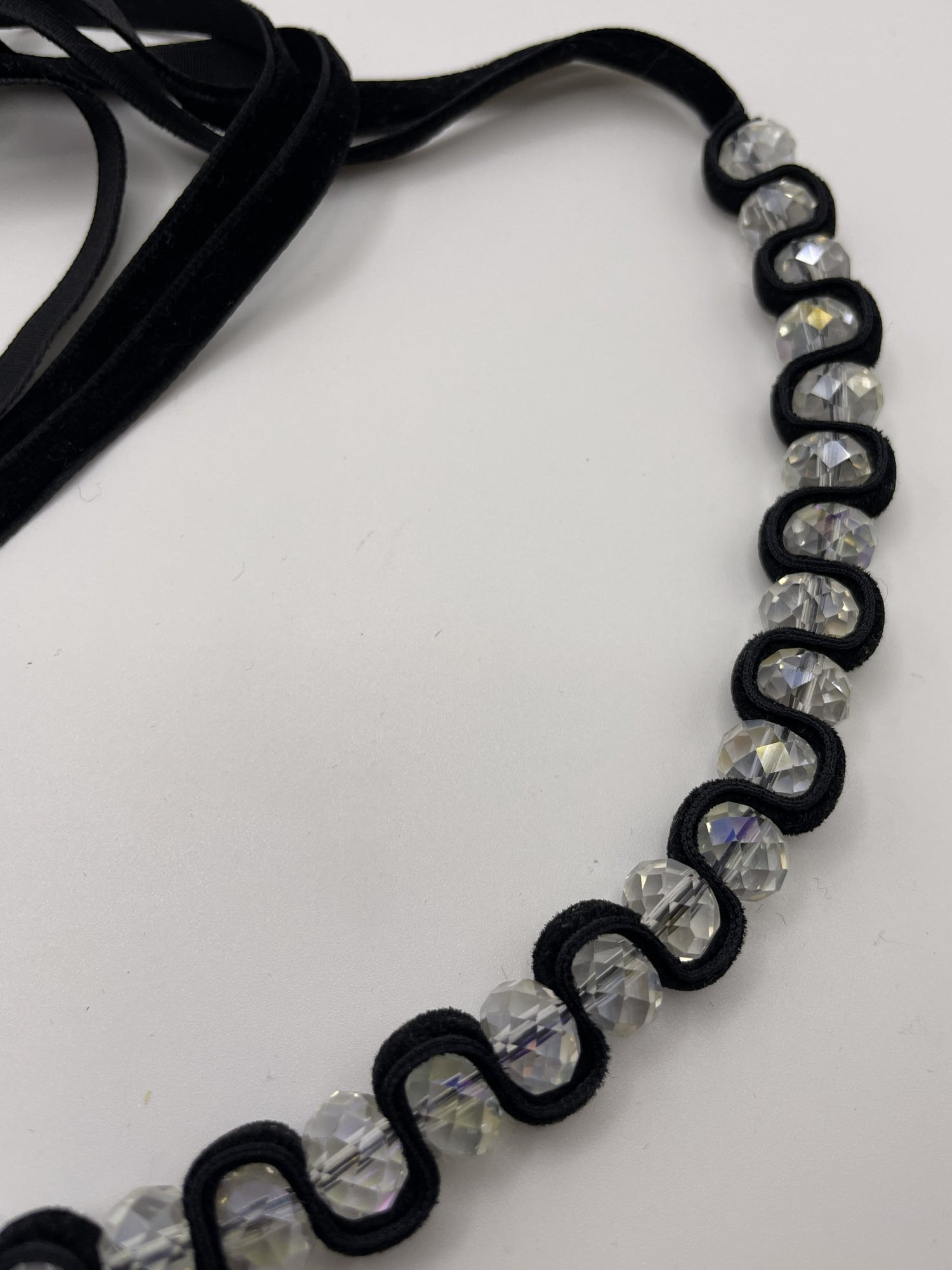 Divine Glass Beads Necklace With Aurora Borealis Finish Wrapped Around a Black Velvet Ribbon